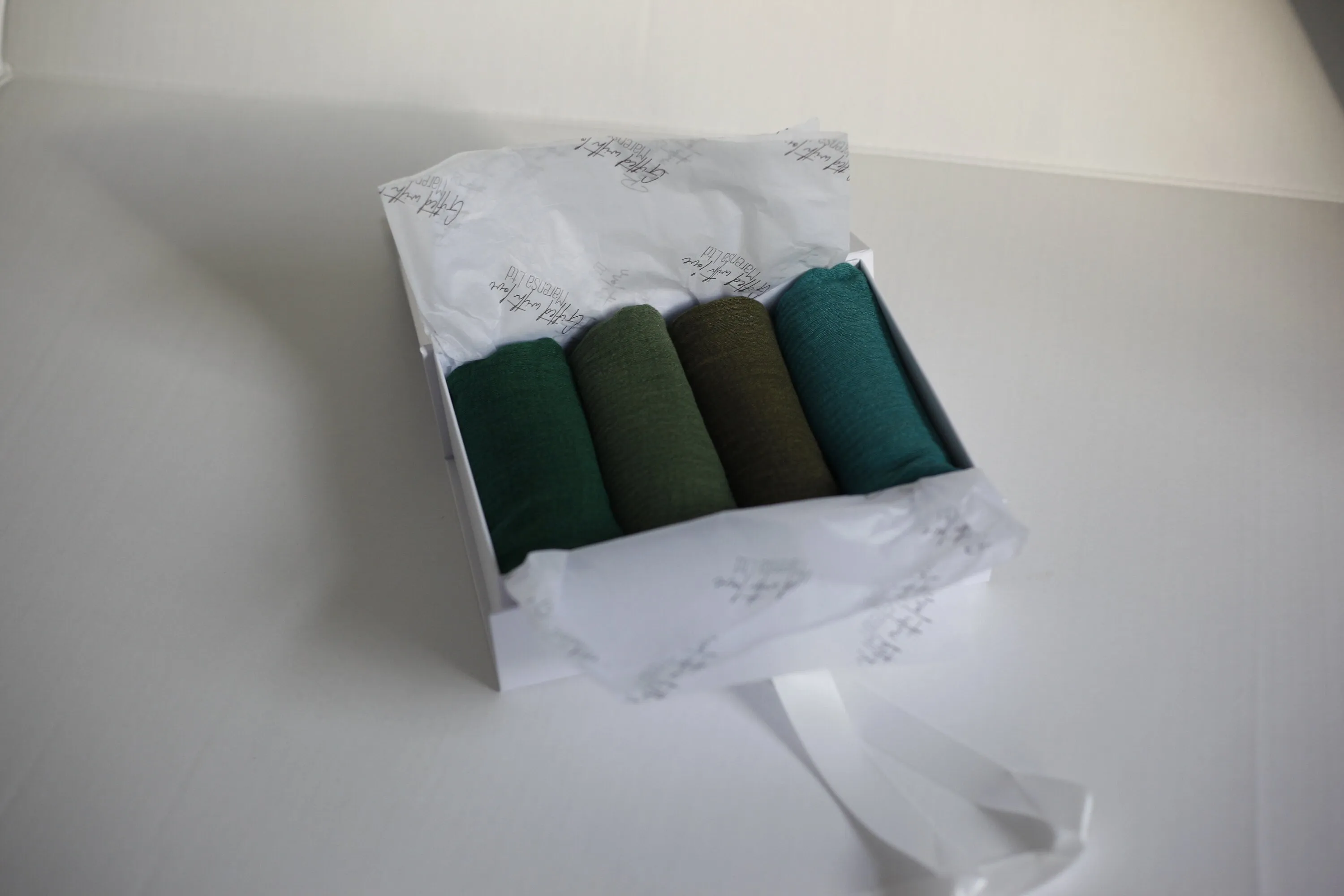 Shades of forest green crimple scarf with distressed edge, Perfect Eid Hijabs, or if you are gifting hijab gifts, perfectly boxed