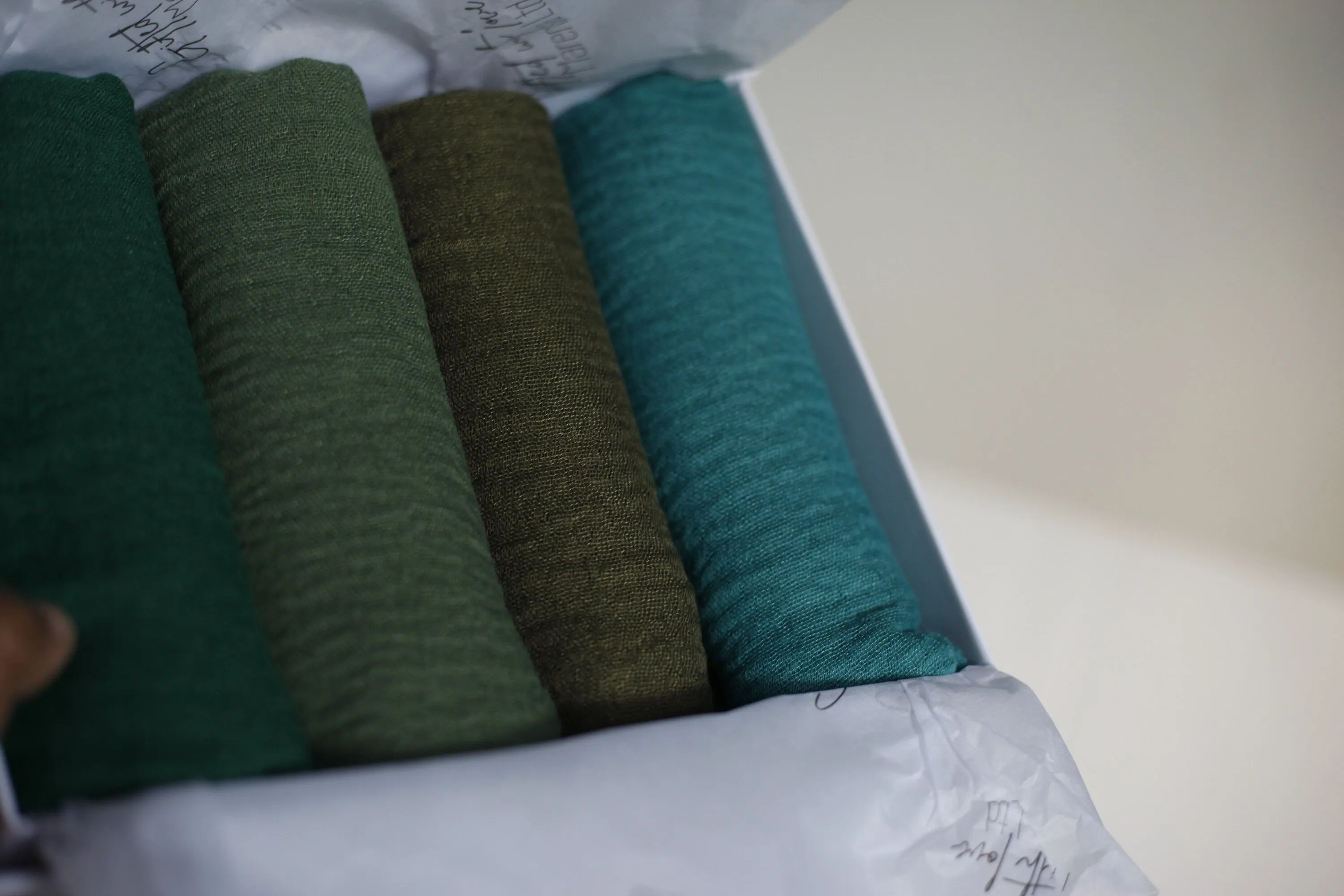 Shades of forest green crimple scarf with distressed edge, Perfect Eid Hijabs, or if you are gifting hijab gifts, perfectly boxed